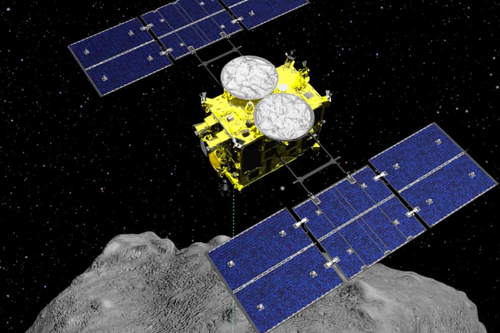 The Hayabusa2 spacecraft above the asteroid Ryugu