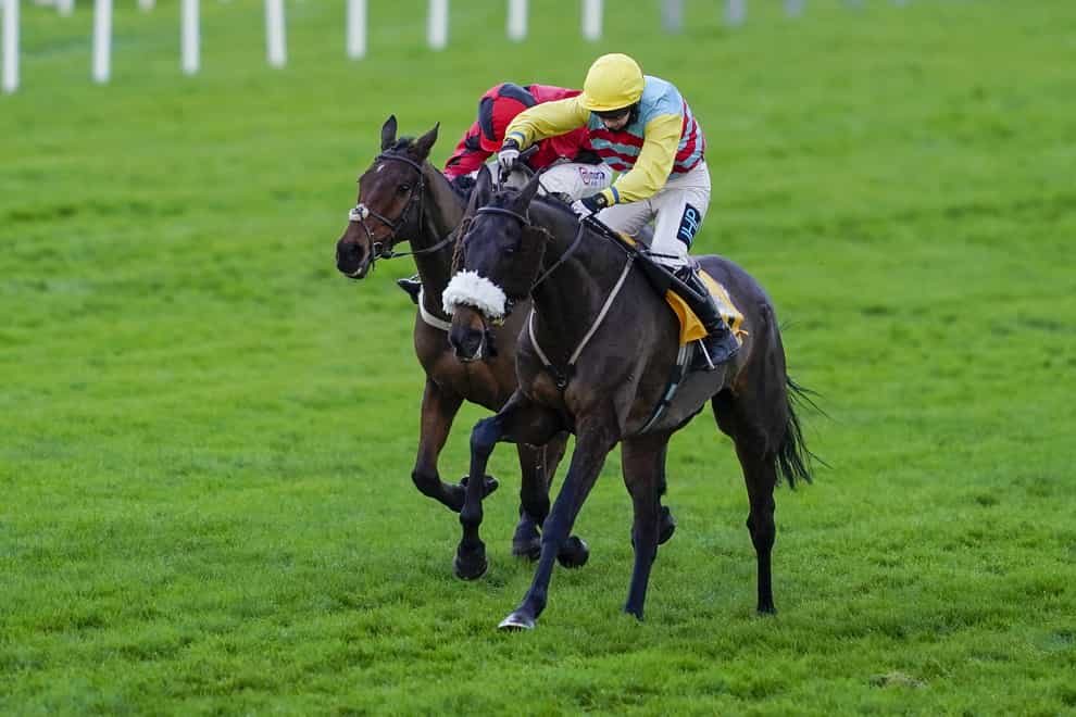 Millie Wonnacott and Doing Fine (right) hold the challenge of Crosspark to win The Betfair Exchange Back And Lay London National Handicap Chase at Sandown