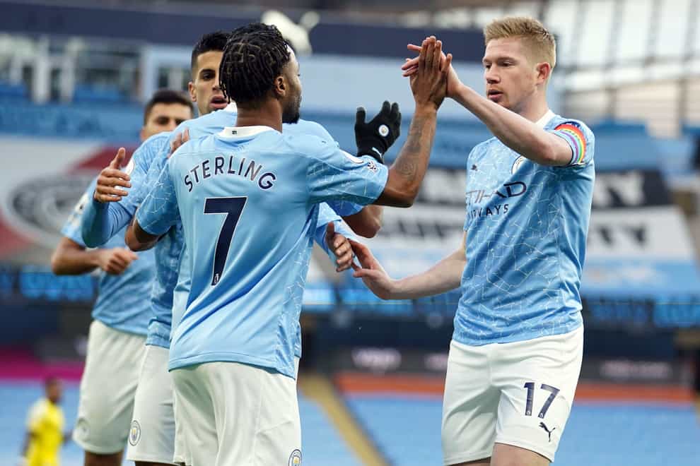 Manchester City’s Raheem Sterling (left) celebrates scoring the opening goal against Fulham