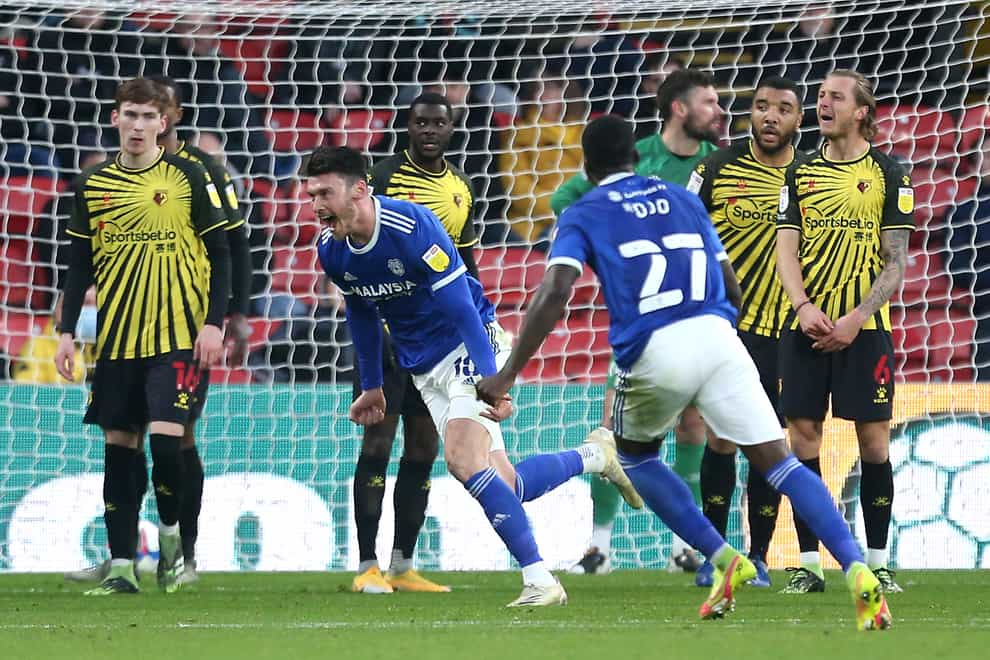 Kieffer Moore (centre) spins away to celebrate scoring Cardiff's winner against Watford at Vicarage Road