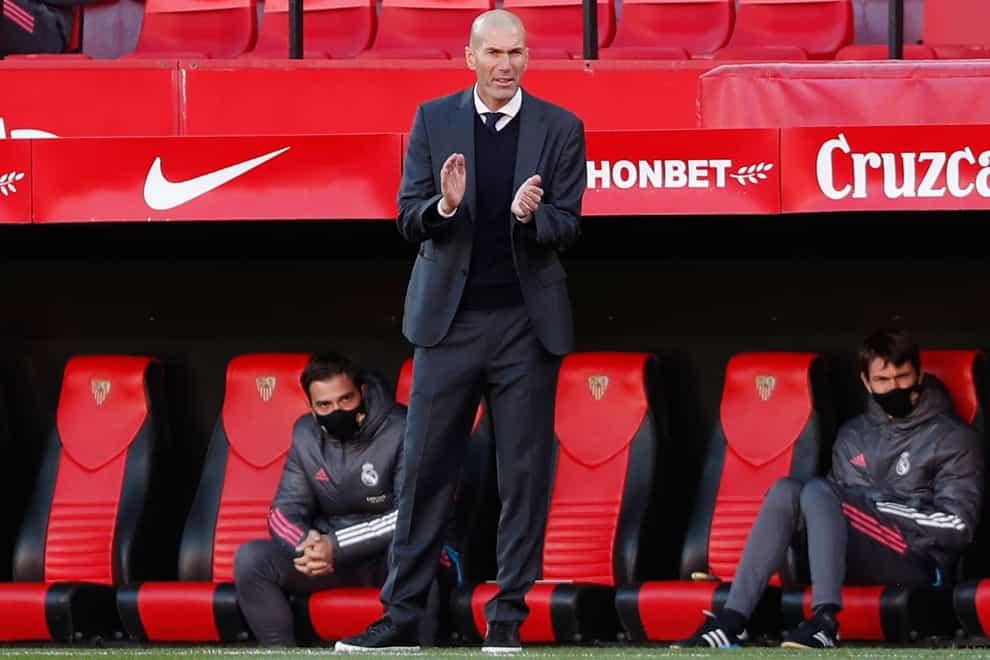 Real Madrid head coach Zinedine Zidane applauds to his players during their victory at Sevilla