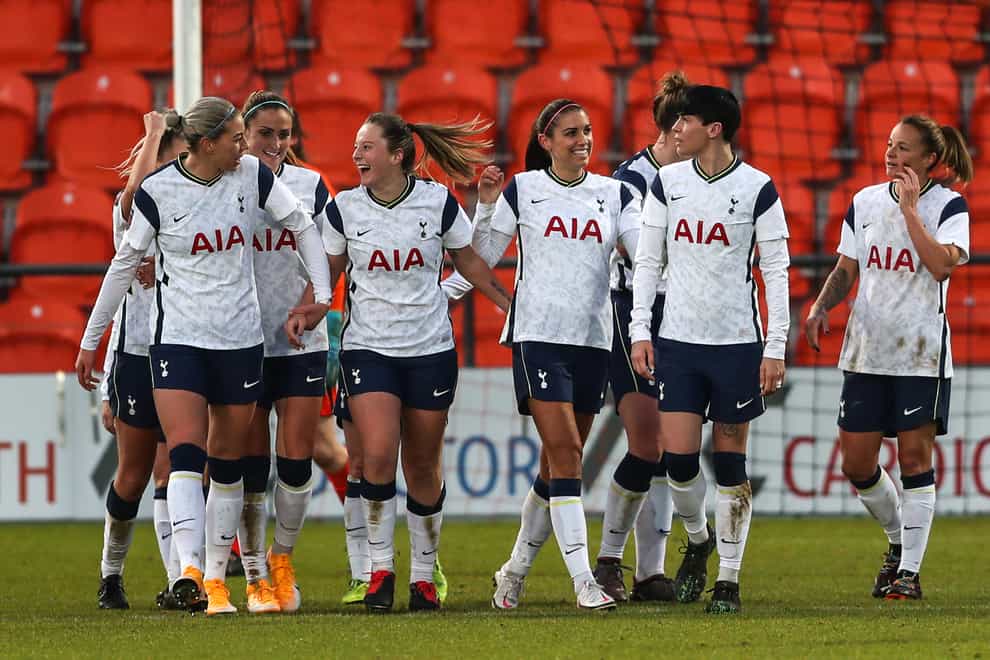 Alex Morgan, centre right, celebrates scoring Tottenham’s third goal