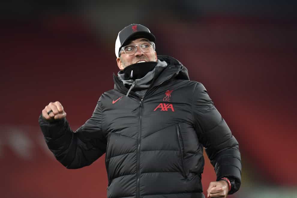Jurgen Klopp celebrates with the crowd after the final whistle against Wolves