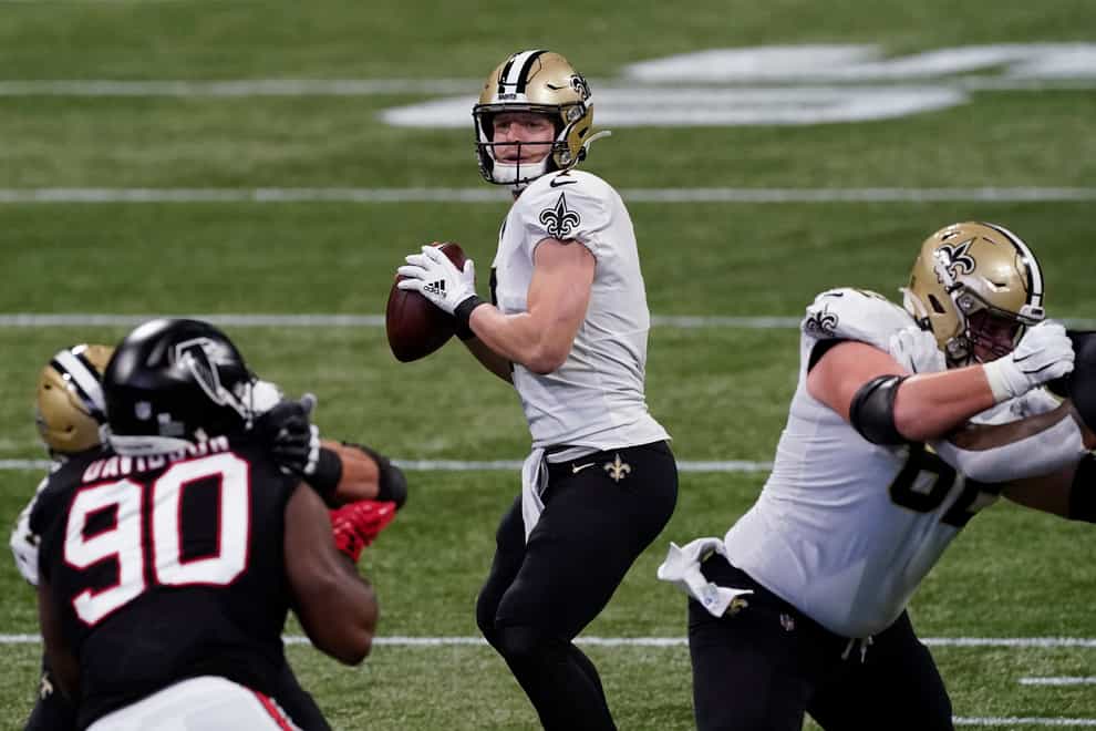 <p>Taysom Hill, centre, was key for New Orleans on Sunday</p>