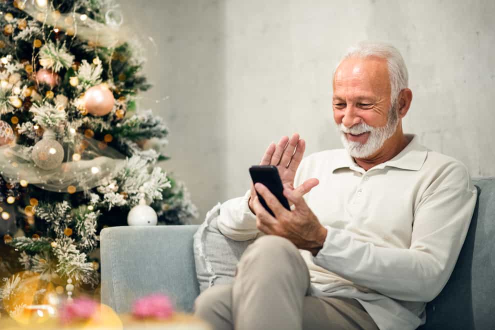 Grandfather holding his mobile phone (iStock/PA)