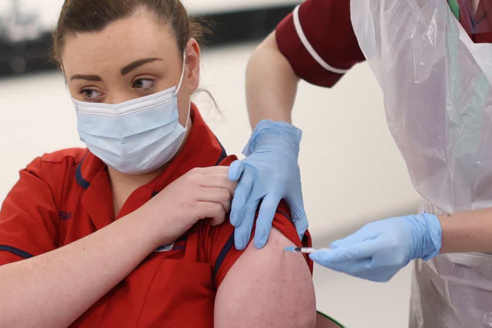 Joanna Sloan receives the vaccine