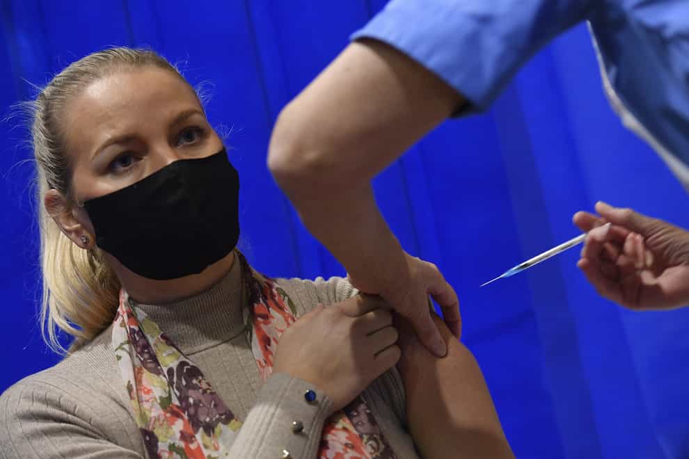 A nurse administers the Pfizer/BioNTech Covid-19 vaccine