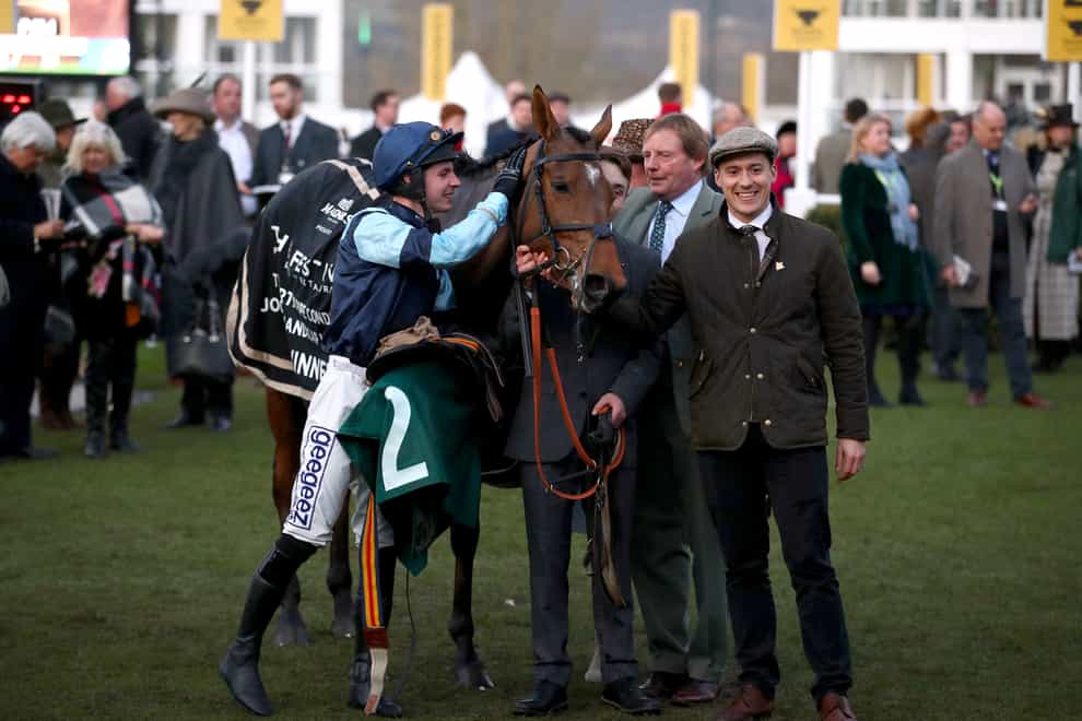 Trainer Paul Webber (second right) after the victory of Indefatigable at the Cheltenham