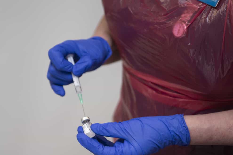 Nurse prepares a vaccine