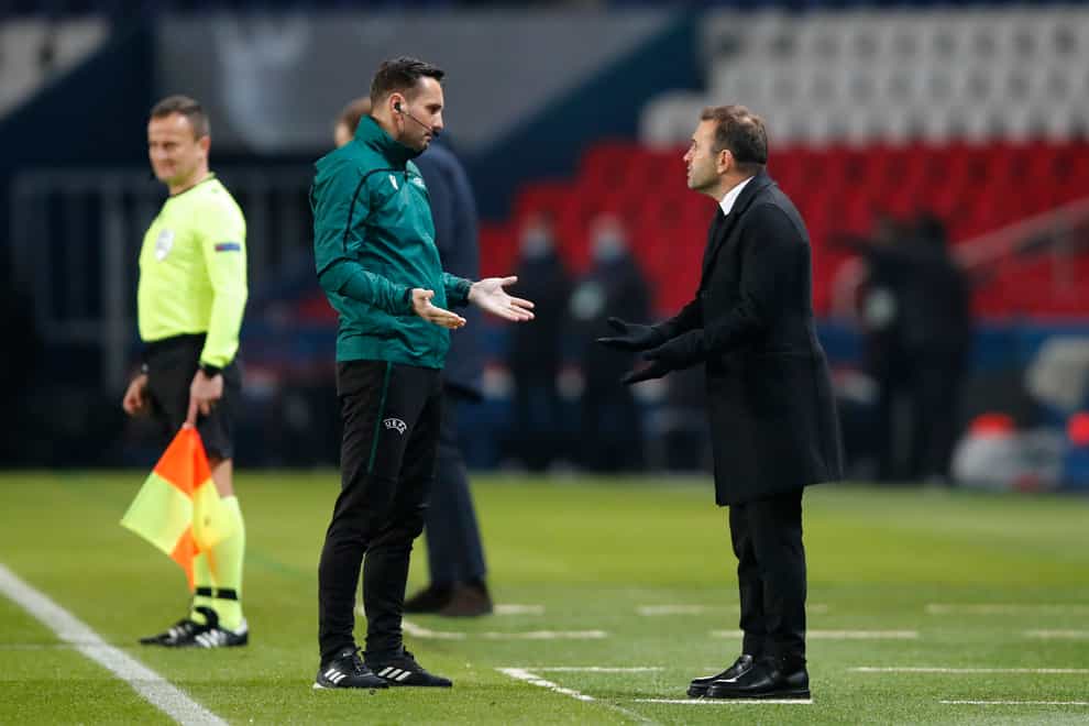 Istanbul Basaksehir manager Okan Buruk, right, argues with an official during the match with Paris St Germain