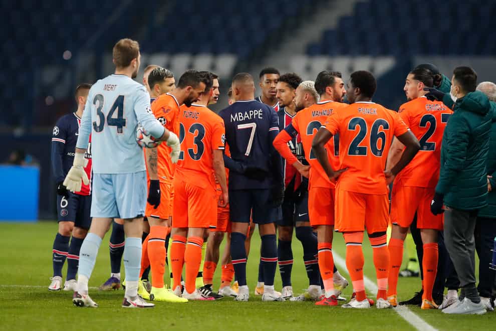 Players from both sides leave the field during Paris St Germain's Champions League tie against Istanbul Basaksehir