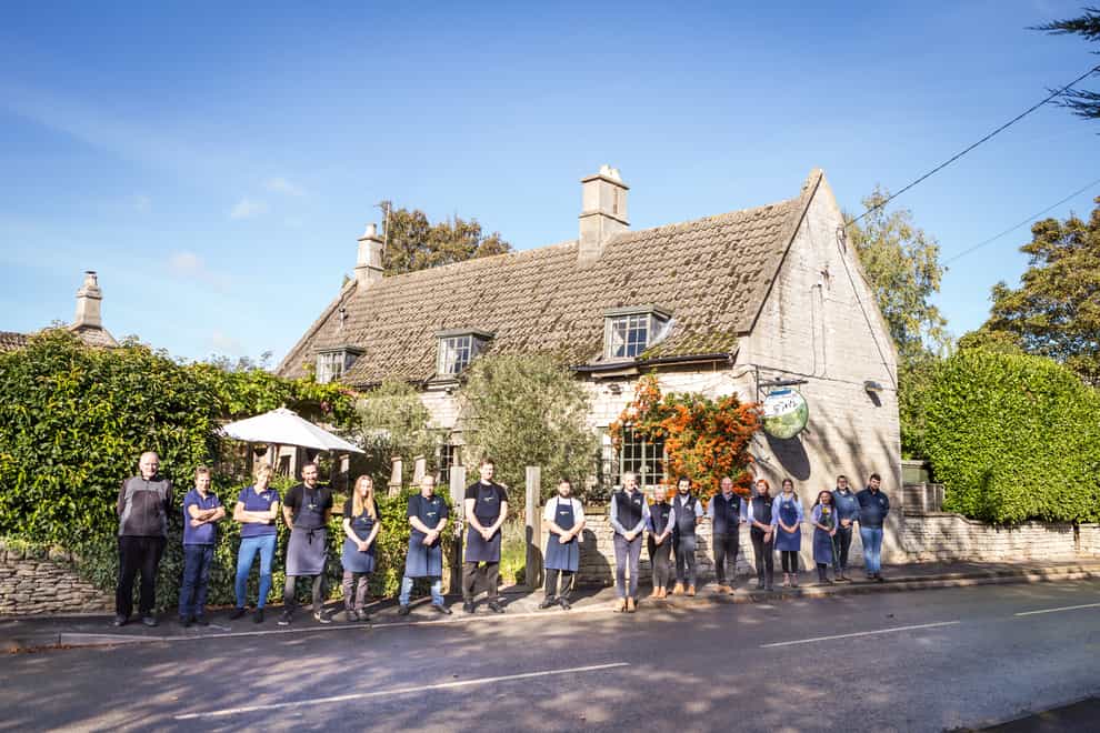 Staff outside The Olive Branch in Clipsham, Rutland, which has been named as UK Pub of the Year