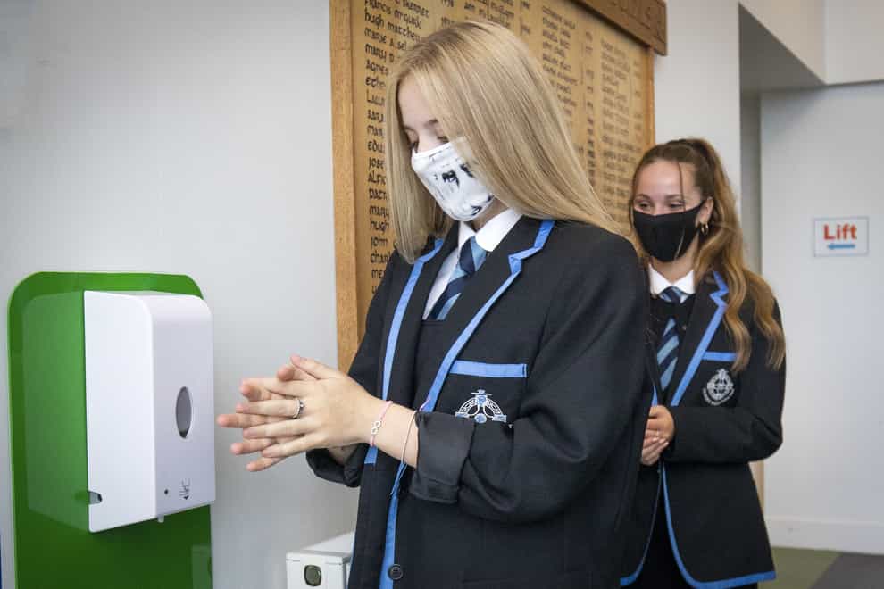 A pupil wears a mask at a secondary school
