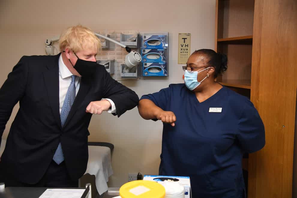 Prime Minister Boris Johnson elbow bumping lead nurse Marina Marquis during a visit to Tollgate Medical Centre in Beckton in East London (Evening Standard/PA)