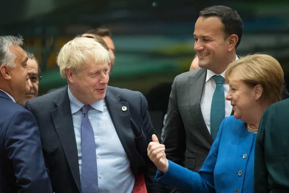 Boris Johnson with Angela Merkel (right)