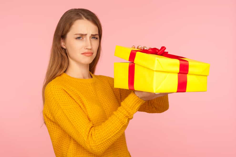 disappointed person with present