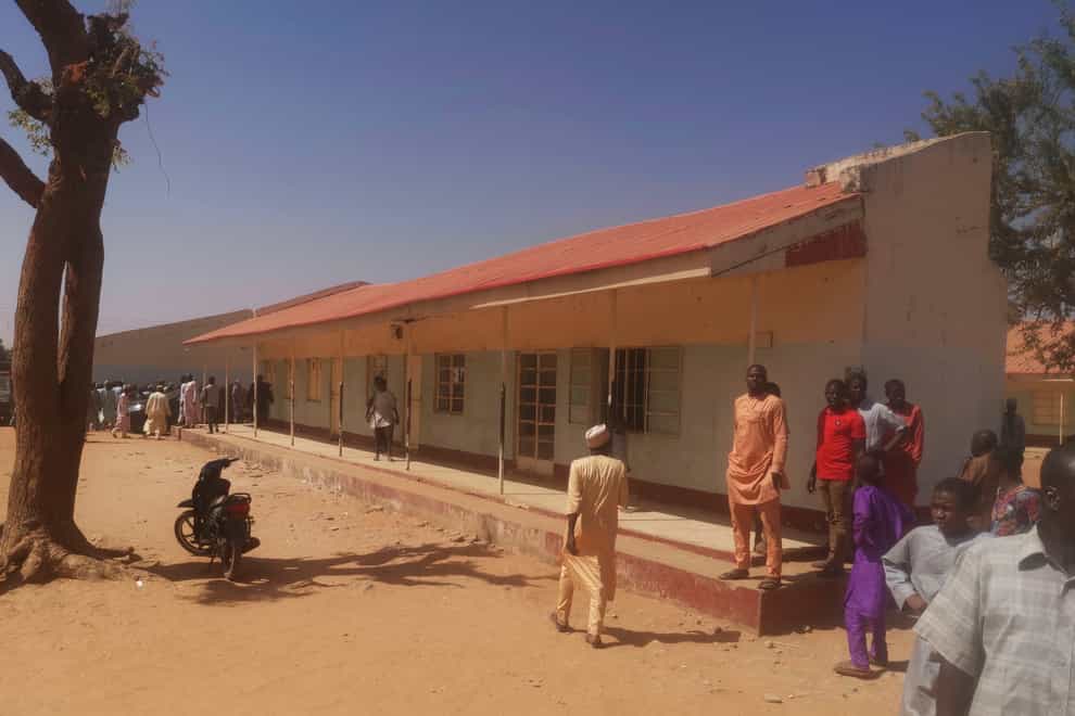 People gather inside the Government Science Secondary School in Kankara, Nigeria (Abdullatif Yusuf/AP)