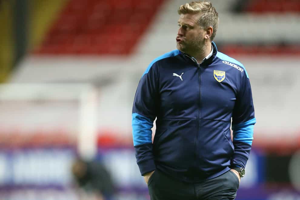 Karl Robinson will be without Rob Atkinson
