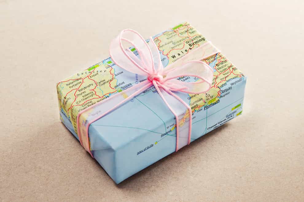 Gift with world map wrapping paper (iStock/PA)