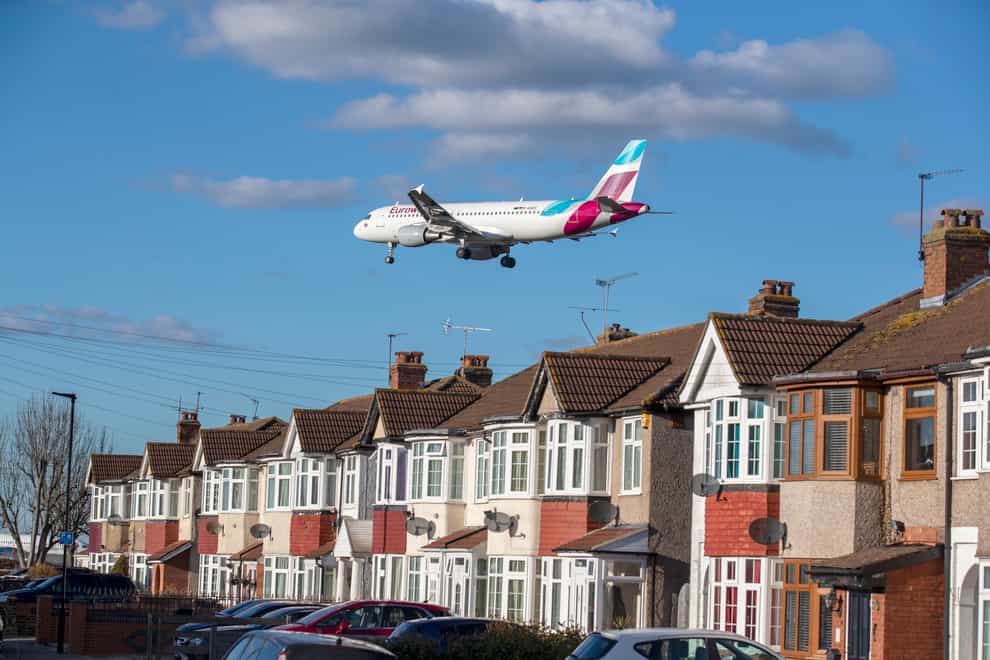 A plane lands at Heathrow Airport