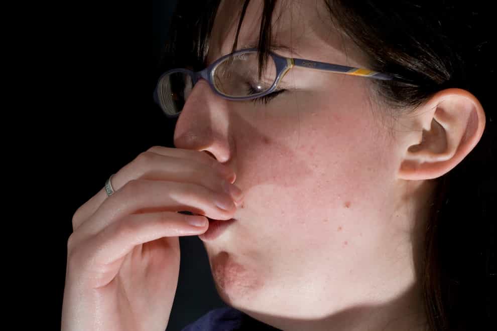 A coughing woman