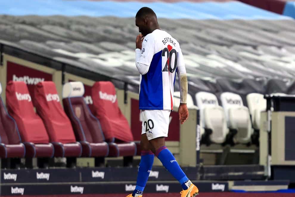 Christian Benteke leaves the pitch after a red card