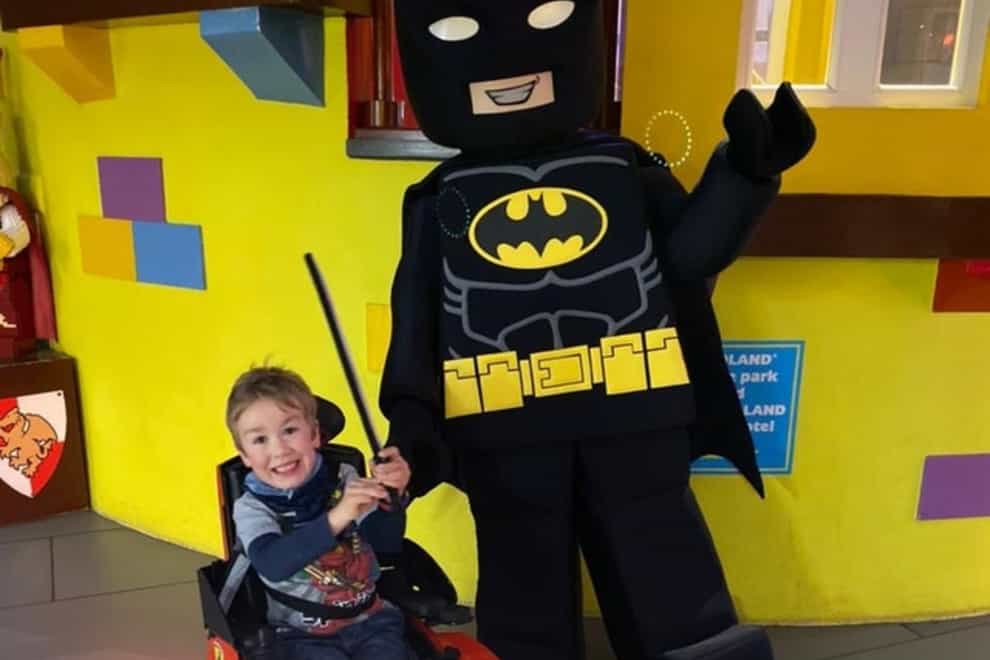 Sebby Brett, 5, whose mother is calling on Legoland to change its disabled policy after her son was made to get up out of his wheelchair twice and walk, before he was allowed on the rides
