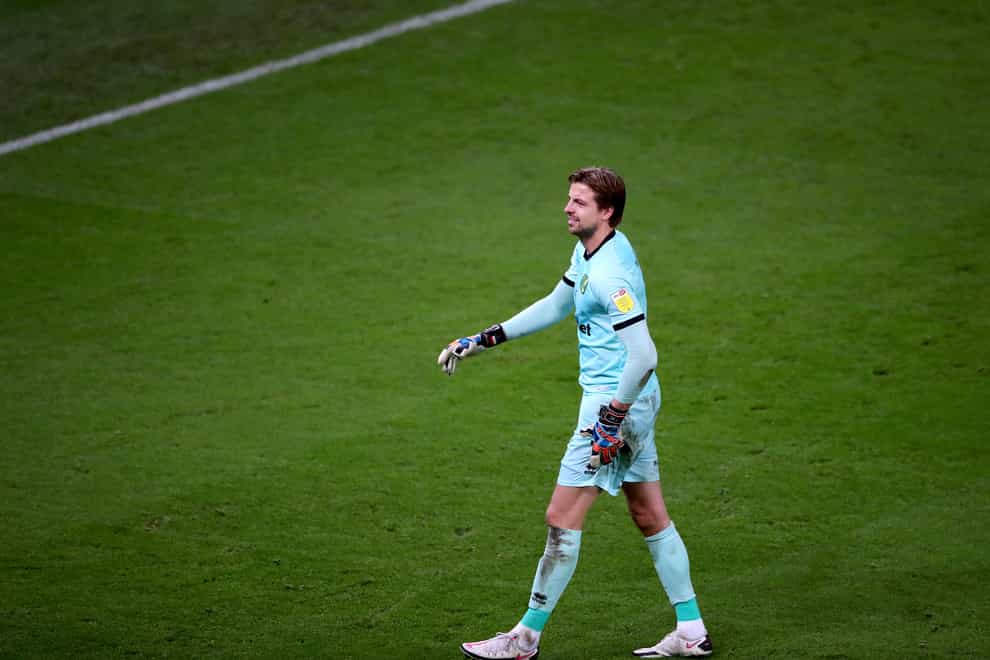 Norwich goalkeeper Tim Krul walks off the pitch with an injury