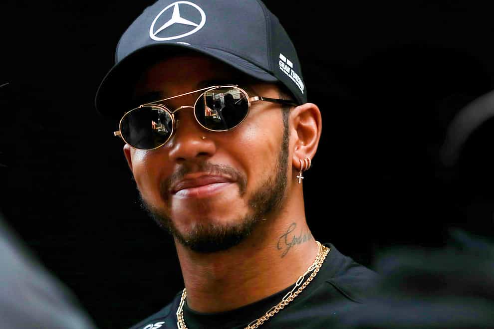 Lewis Hamilton looks on