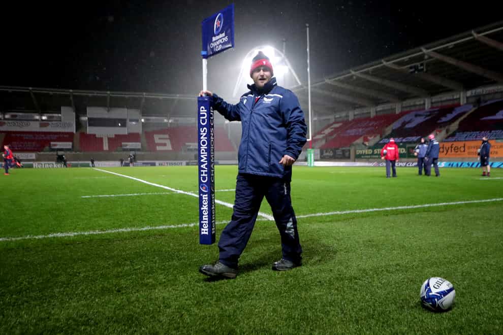 A groundsman removes the corner flag after the Scarlets-Toulon game was called off