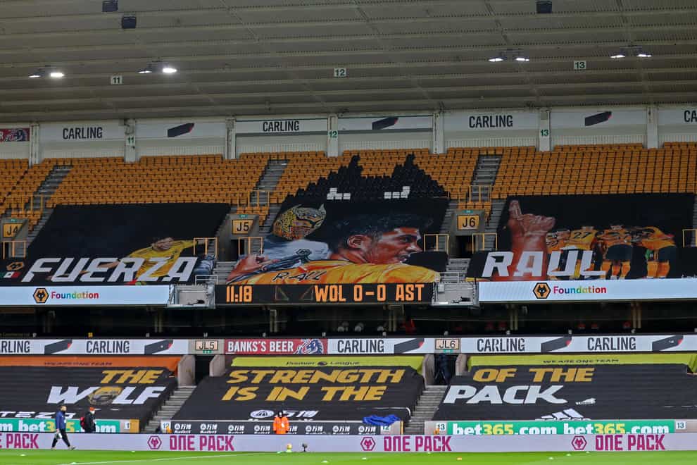 A banner at Molineux displays support for Raul Jimenez