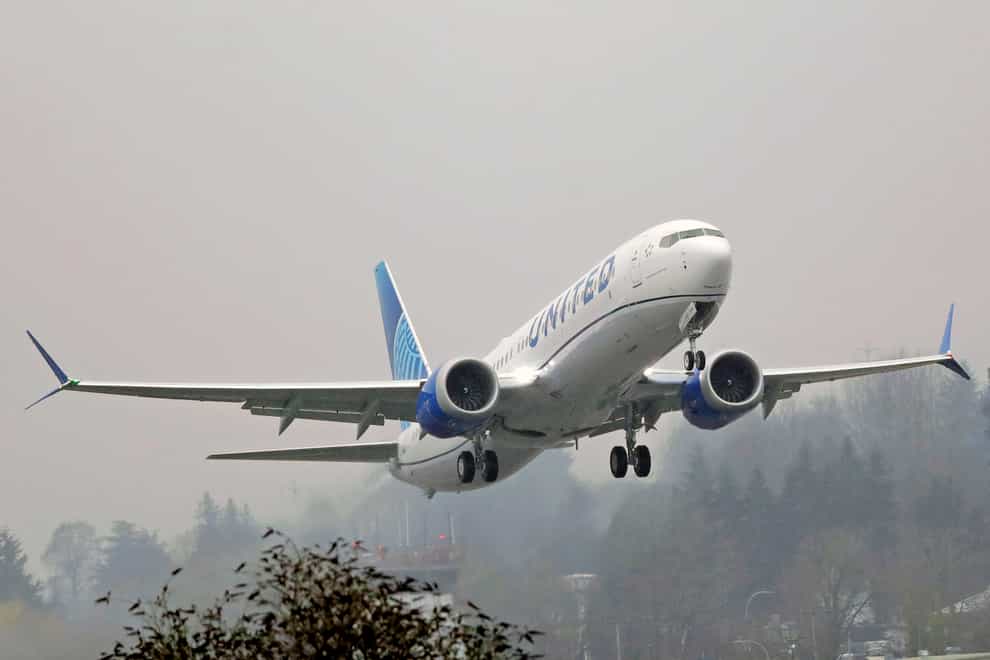 A United Airlines Boeing 737 Max airplane takes off in the rain at Renton Municipal Airport in Renton, Washington