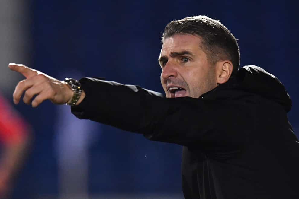 Ryan Lowe points on the touchline
