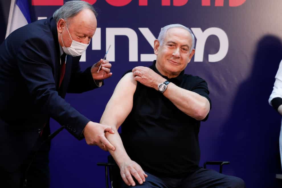 Israeli prime minister Minister Benjamin Netanyahu receives a coronavirus vaccine (Amir Cohen/AP)