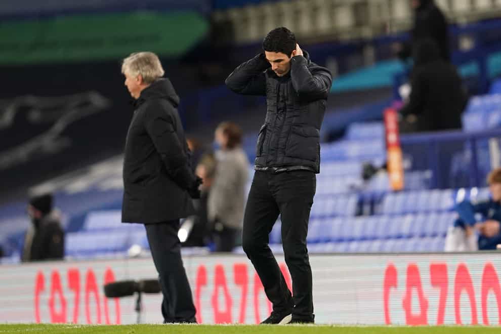 Mikel Arteta (right) dejected on the touchline