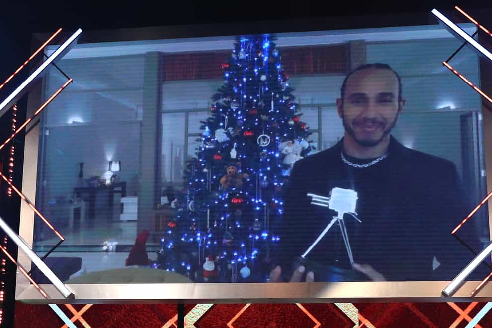 Lewis Hamilton pictured with the Sports Personality of the Year trophy