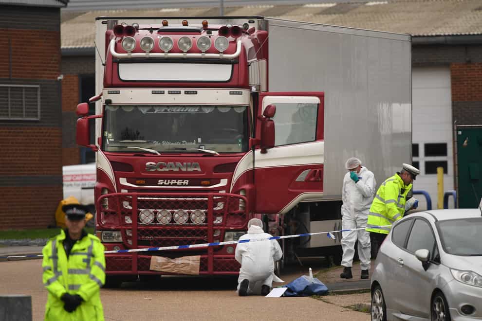Police examine the lorry at the Waterglade Industrial Park in Grays, Essex