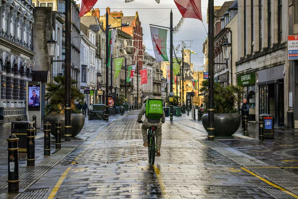 A takeaway delivery cyclist in Cardiff city centre after the latest lockdown began