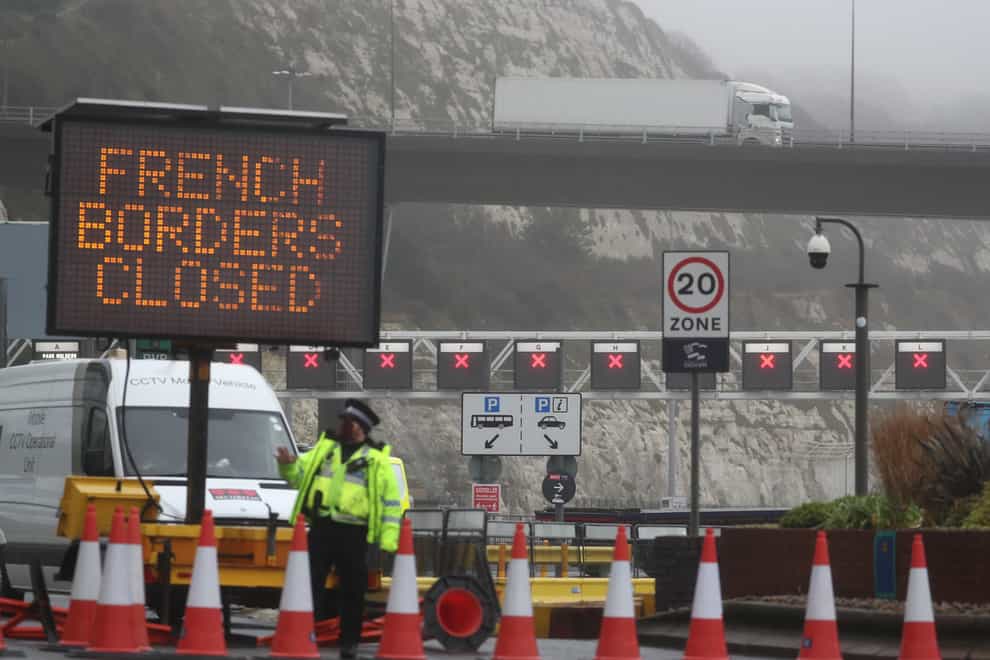 Police and port staff at the Port of Dover in Kent which has been closed after the French government’s announcement it will not accept any passengers arriving from the UK for the next 48 hours amid fears over the new mutant coronavirus strain (Steve Parsons/PA)