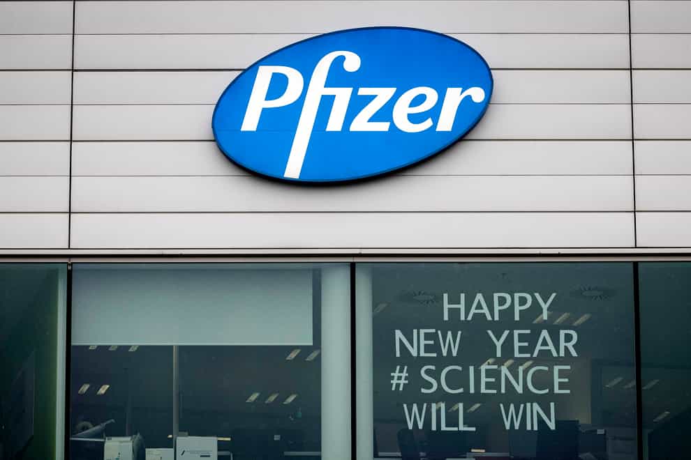 A sign in the window of an office at Pfizer Manufacturing in Puurs, Belgium