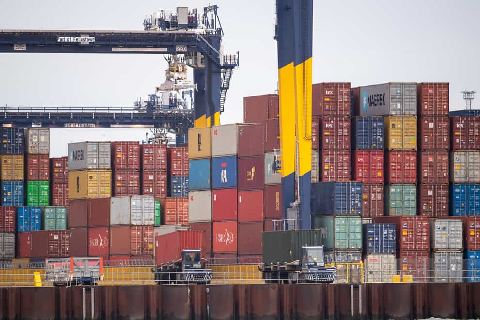Shipping containers are unloaded from a cargo ship at the Port of Felixstowe in Suffolk (Joe Giddens/PA)
