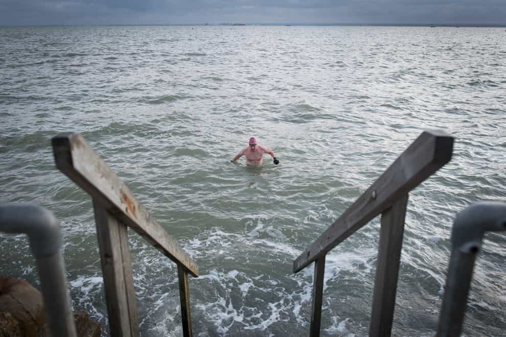 Swimmers take their daily dip in the Thames estuary at Leigh On Sea in Essex. Due to this year’s Coronavirus pandemic there has been a huge surge in popularity of open water swimming in the sea, rivers and lakes across the country. Many people have given themselves the challenge of swimming everyday throughout the winter to maintain their mental and physical well being whilst work and travel has been severely restricted by Covid 19 rules. These pictures were all taken during the months of November and December 2020 in all conditions.