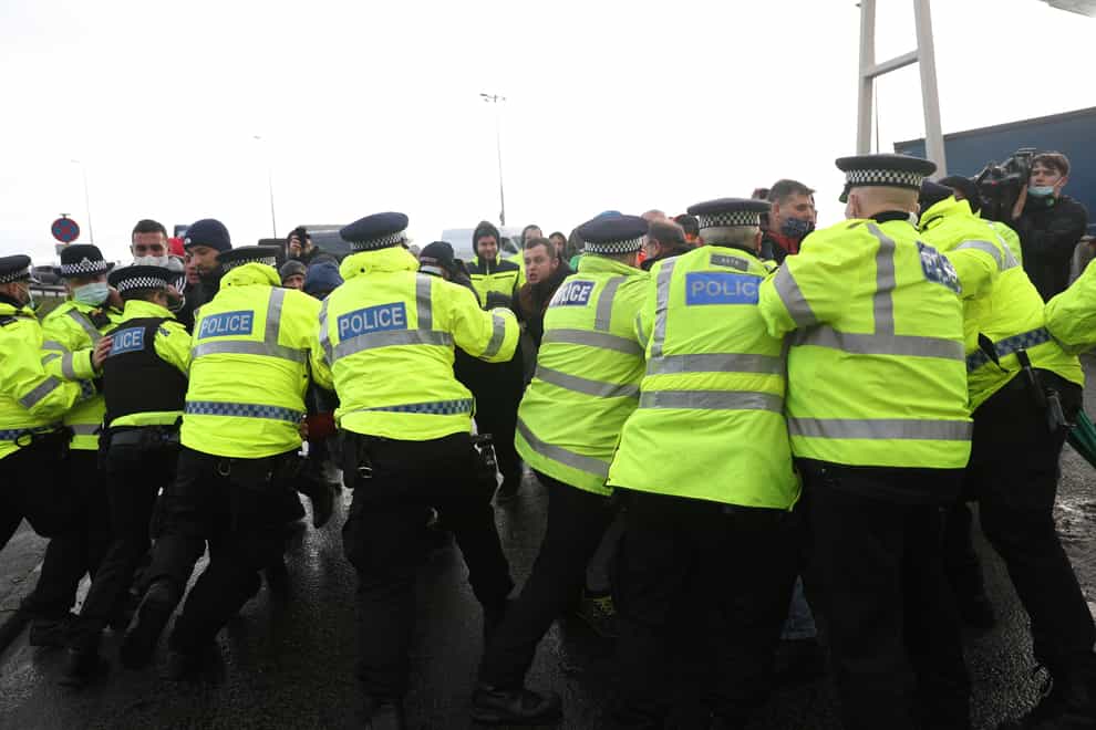 Police scuffle with lorry drivers outside the Port of Dover in Kent