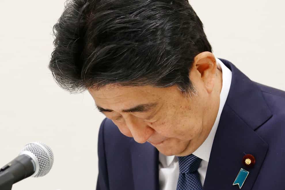 Former Japanese prime minister Shinzo Abe bows during a press conference in Tokyo (AP)