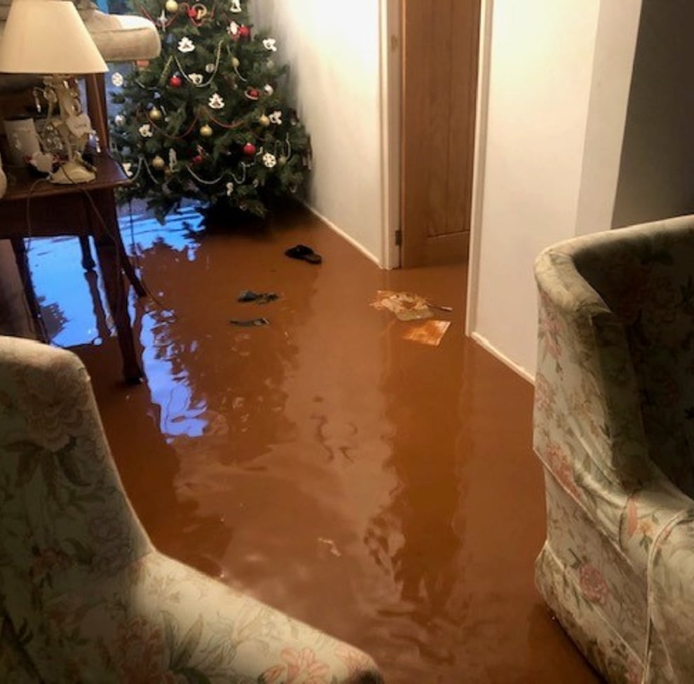 Flood water surrounds a Christmas tree at Helddwyn James home in Sully, south Wales