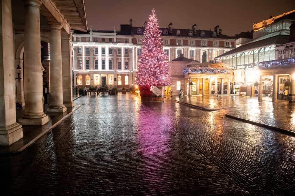 The Christmas tree at a quiet Covent Garden Piazza, in central London, which is currently under Tier 4 coronavirus restrictions.