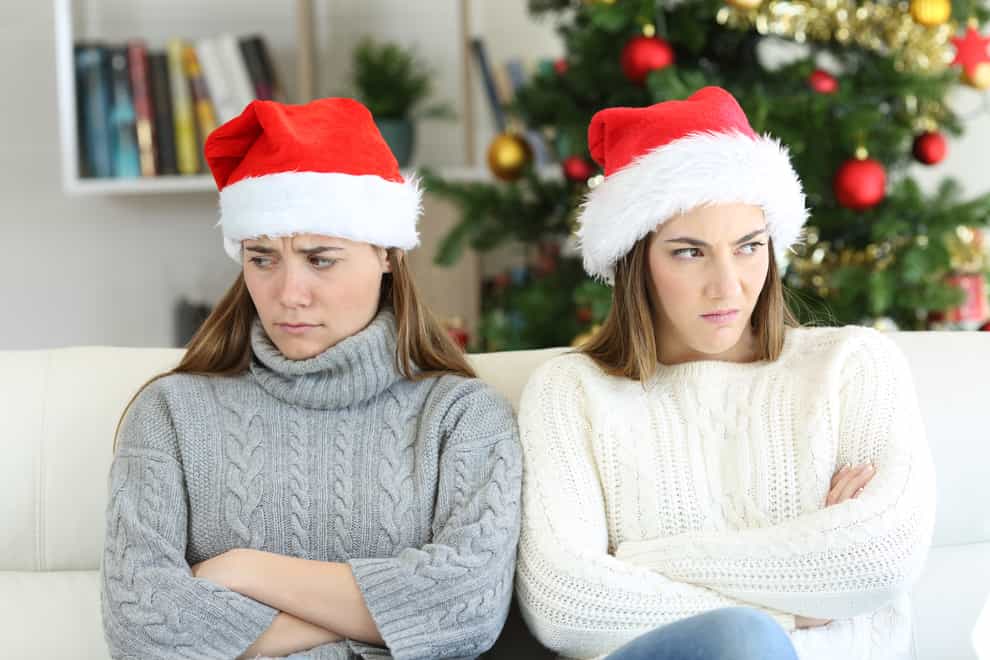 Upset women in Christmas hats