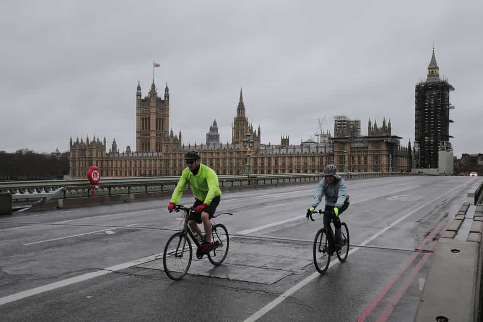 Cyclists near the Houses of Parliament in London