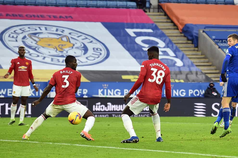 Jamie Vardy watches as his shot goes in off Axel Tuanzebe to earn Leicester a draw