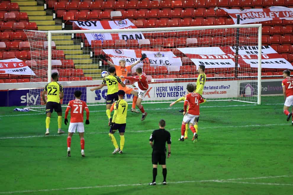 Michal Helik (no 30), scores the dramatic winner for Barnsley against Huddersfield